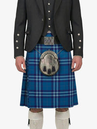 Person wearing a blue plaid kilt with a black jacket on a white background