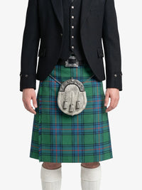 Person wearing a green plaid kilt with a black jacket on a white background
