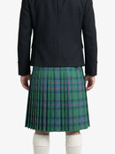 Person wearing a black coat and green plaid kilt on a white background