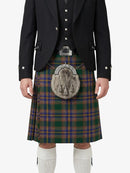 Person wearing a traditional Scottish kilt with a tartan pattern on a white background