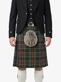 Person wearing a traditional Scottish kilt with a tartan pattern on a white background