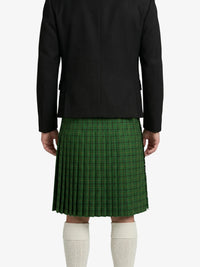Person wearing a black jacket and green plaid kilt on a white background