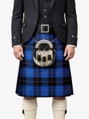 Person wearing a blue plaid kilt with a tartan pouch on a white background
