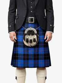 Person wearing a blue plaid kilt with a tartan pouch on a white background