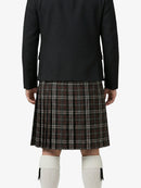 Person wearing a black jacket and plaid kilt on a white background
