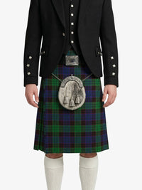 Person wearing a black jacket and green plaid kilt with a silver sporran on a white background