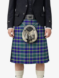Person wearing a tartan kilt with a jacket on a white background