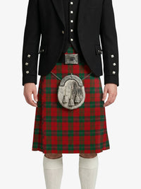 Person wearing a black jacket with silver buttons and a red tartan kilt on a white background