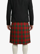 Person wearing a black jacket and red plaid skirt on a white background