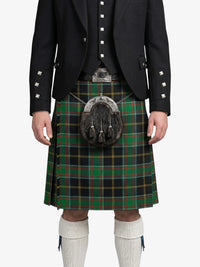 Person wearing a traditional Scottish kilt with a tartan pattern on a white background