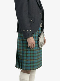 Person wearing a dark jacket and blue plaid kilt on a white background