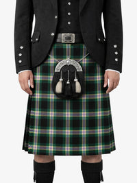 Person wearing a traditional Scottish kilt with a tartan pattern on a white background