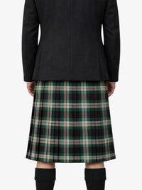 Person wearing a black jacket and plaid kilt on a white background