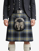 Person wearing a traditional Scottish kilt with a sporran on a white background