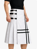 White skirt with black accents worn by a person on a white background