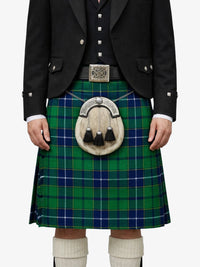 Person wearing a green and blue plaid kilt with a black jacket on a white background
