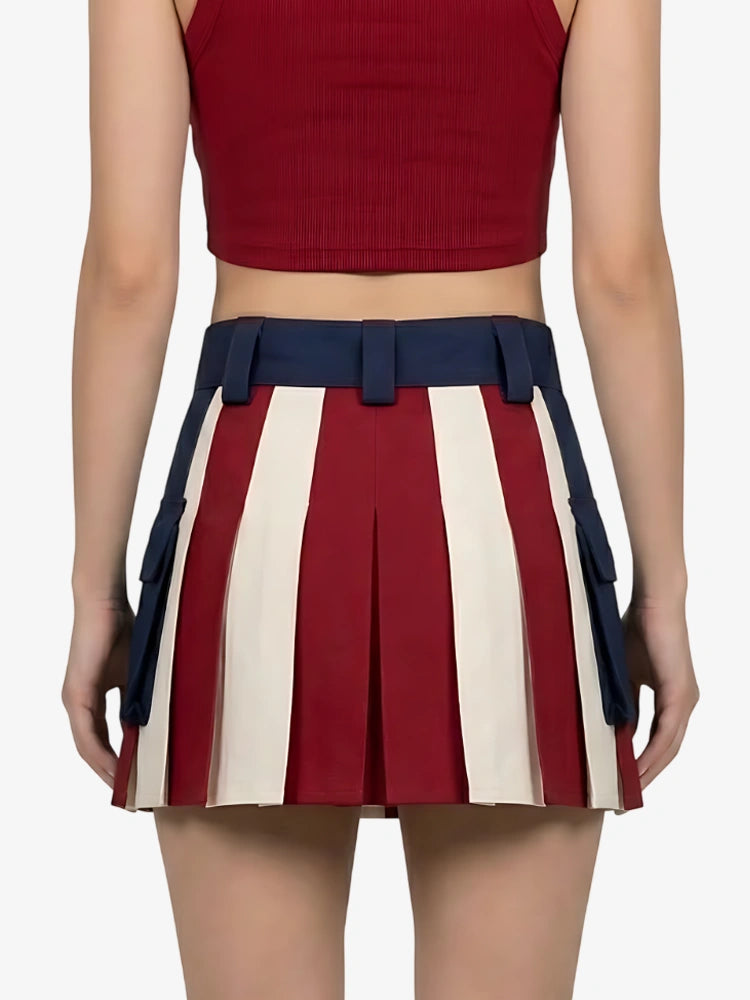 Person wearing a red top and a pleated skirt with red, white, and blue stripes on a white background