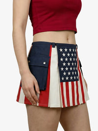 Person wearing a skirt with American flag design on a plain background