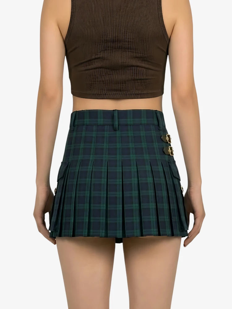 Person wearing a brown crop top and green plaid skirt on a white background